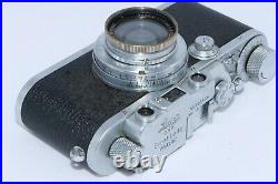 Leica IIIa 35mm rangefinder camera. Summar 5cm f2 standard lens. Case and Instr