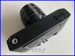 Set fotografico Leica M5, con Noctilux 11 e Tele-Elmar 135 paraluce e borsa